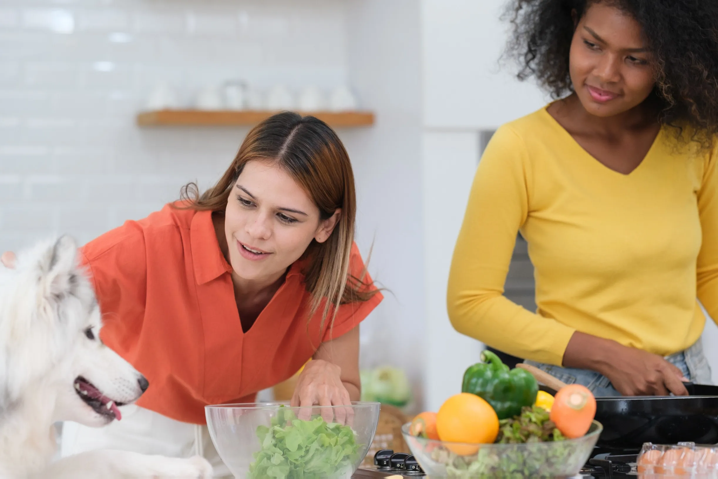 a couple of women in a kitchen - Eating Disorders