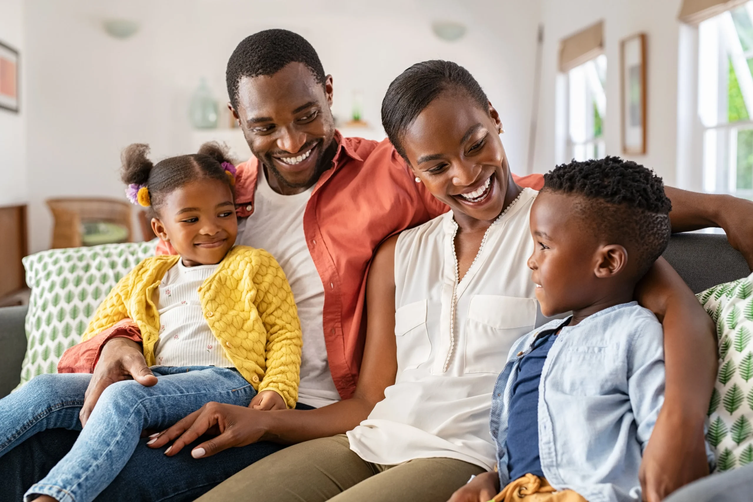 a man and woman sitting on a couch with children - ADHD Treatment cover image