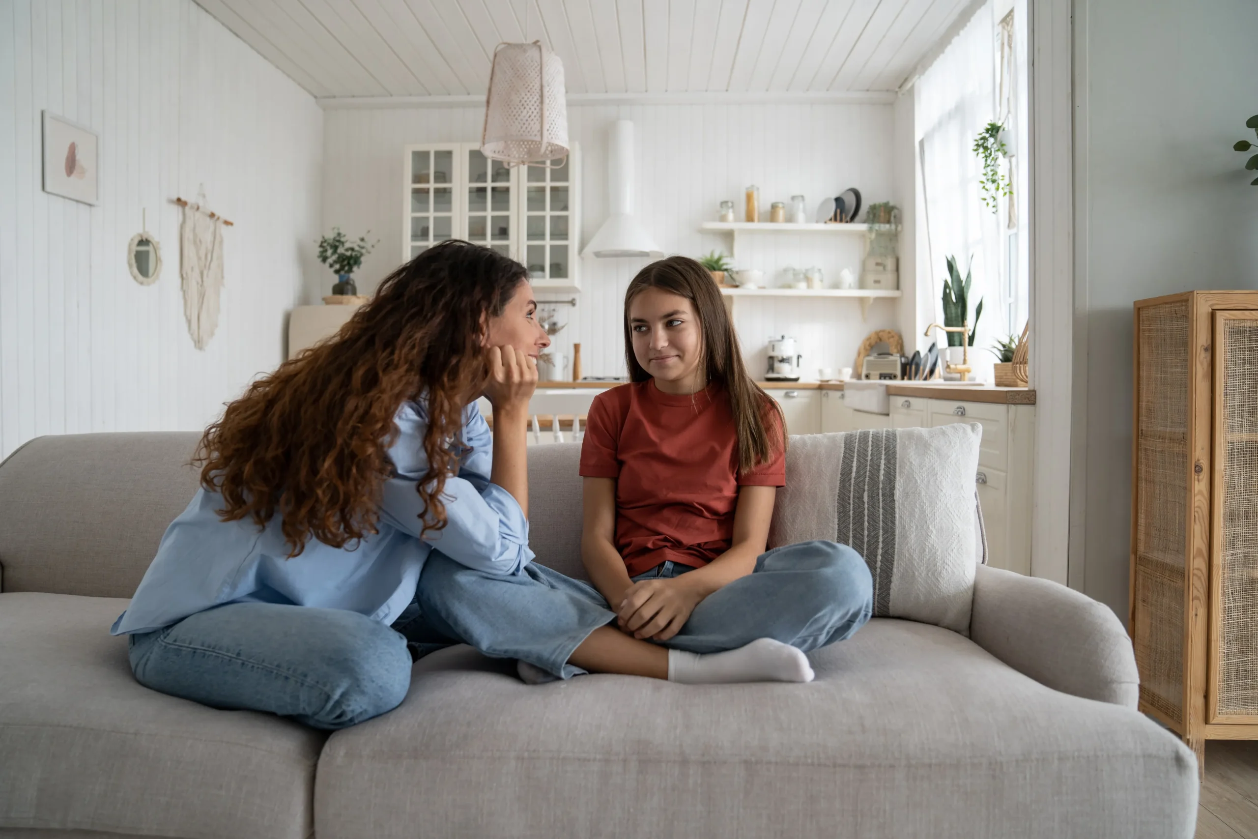 a woman and a girl sitting on a couch - Anxiety treatment cover