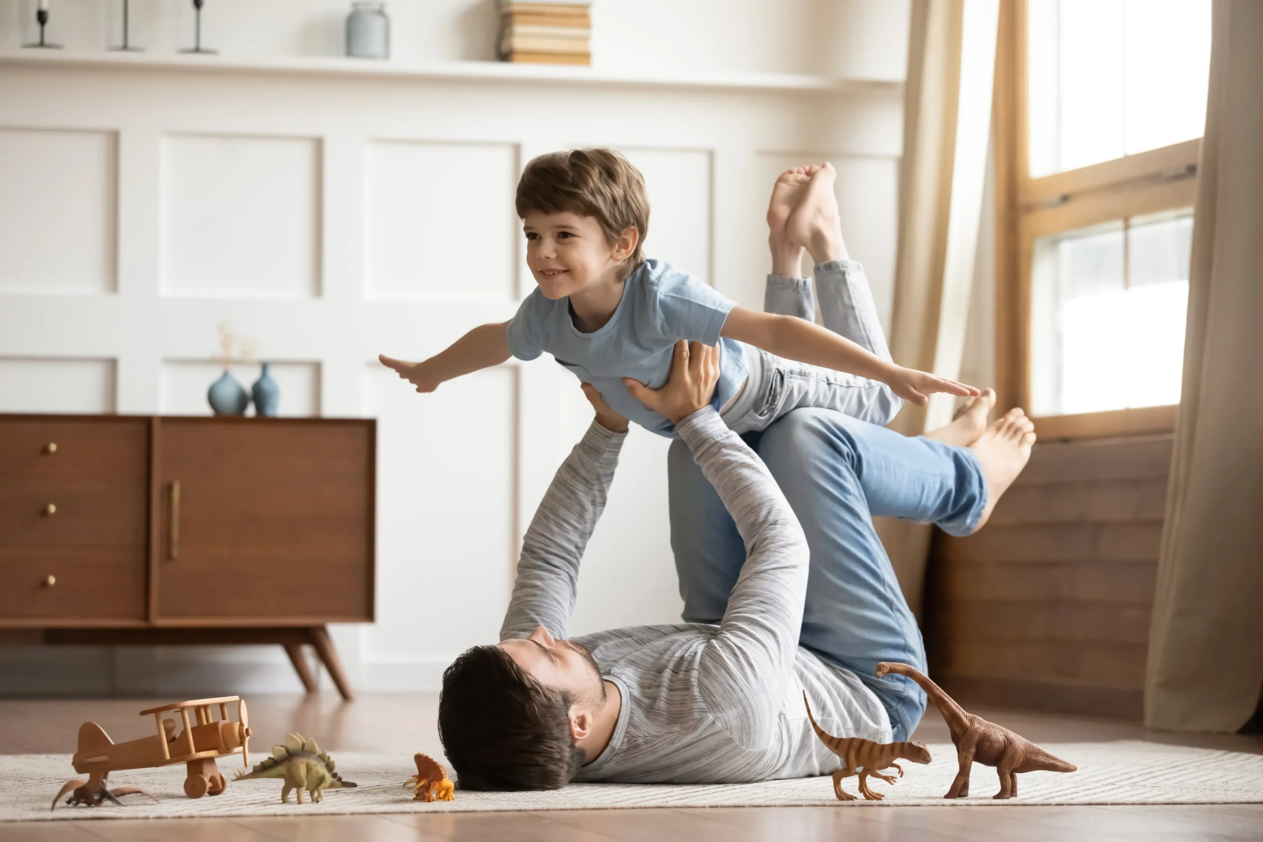 a man holding a child on his shoulders - Autism care cover