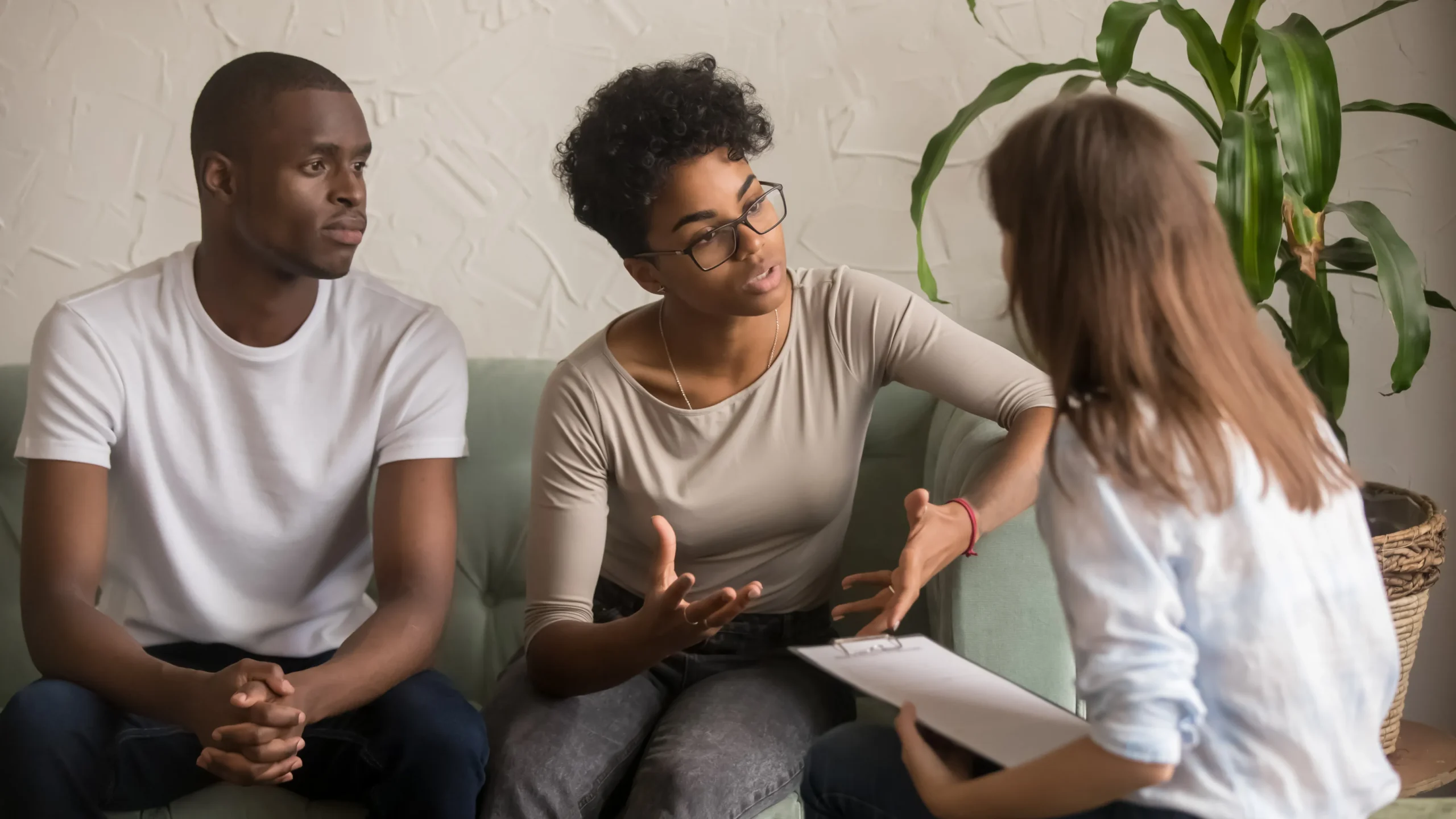 a group of people sitting on a couch talking to a woman - Depression Treatment cover