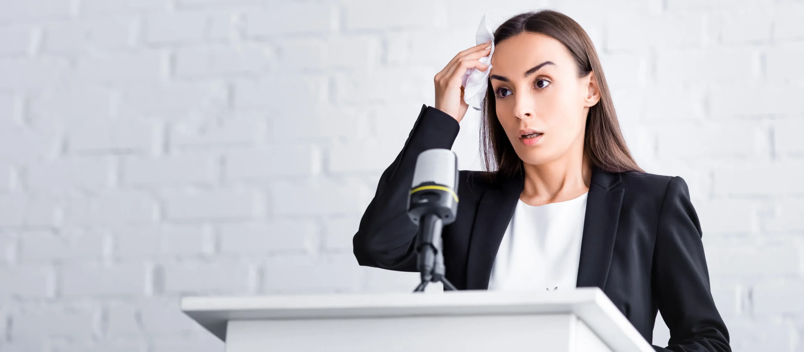 a woman wiping her forehead with a tissue - Phobias Treatment cover