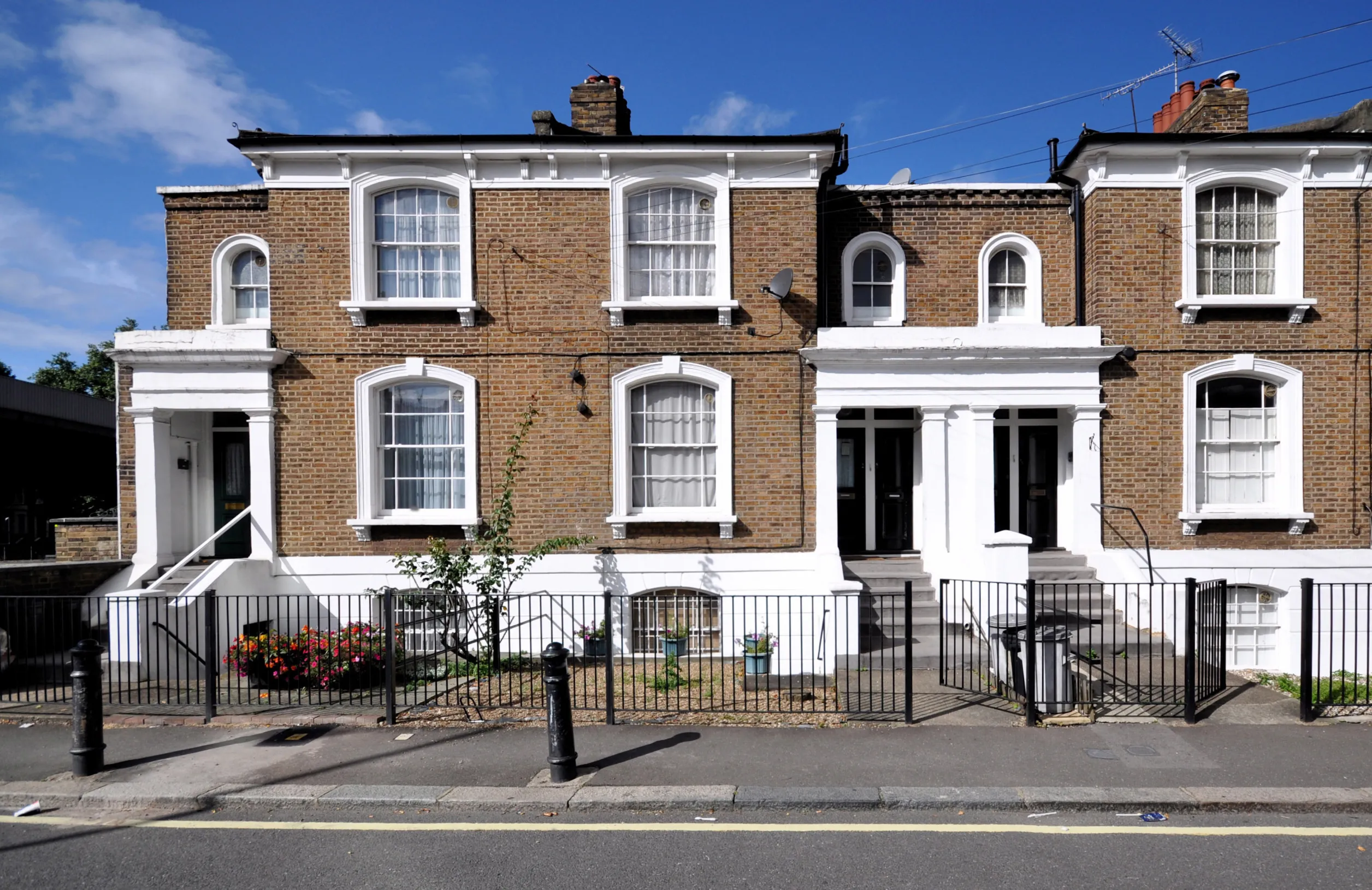 a brick building with a fence