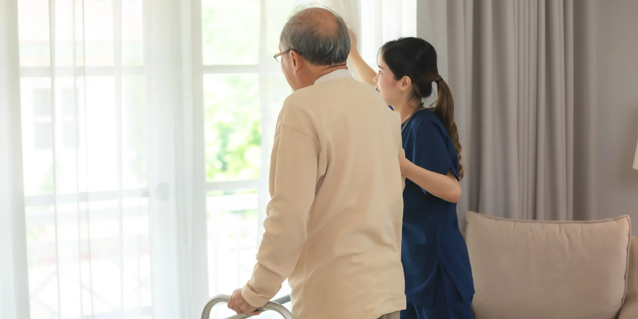 a woman helping an old man