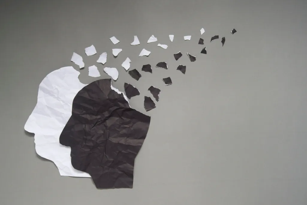 a black and white paper cut out of a head