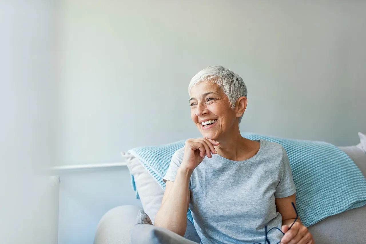 a woman smiling with glasses - Dementia