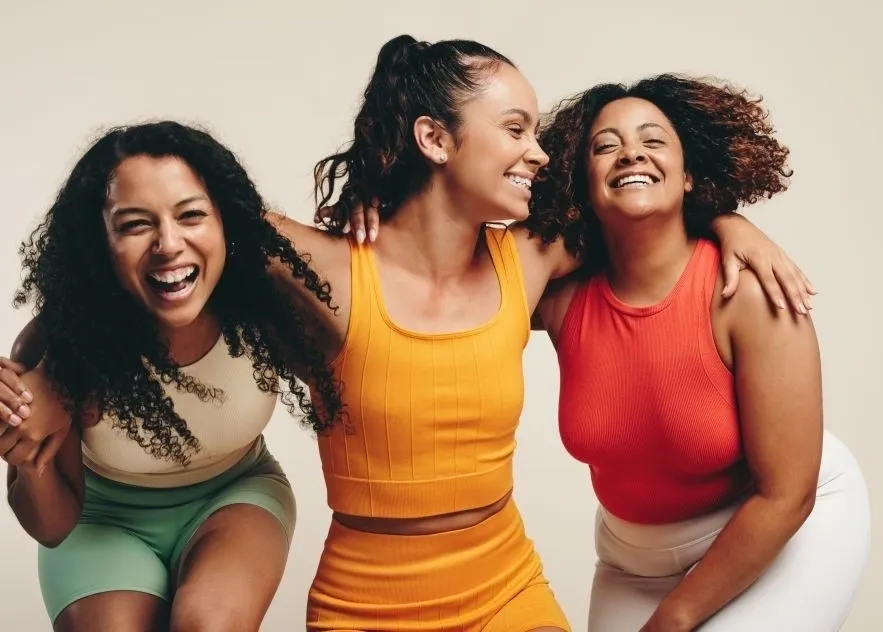 a group of women smiling - Eating Disorders